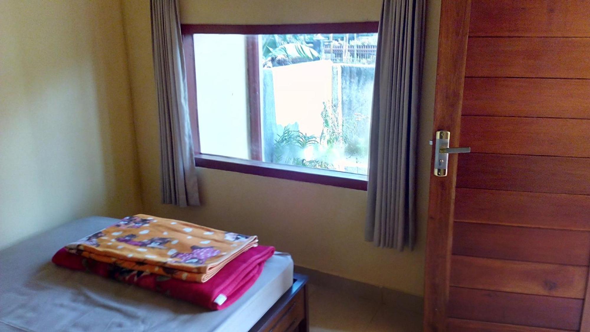 Radiya Guesthouse ซัมบาลัง ลาวัง ห้อง รูปภาพ